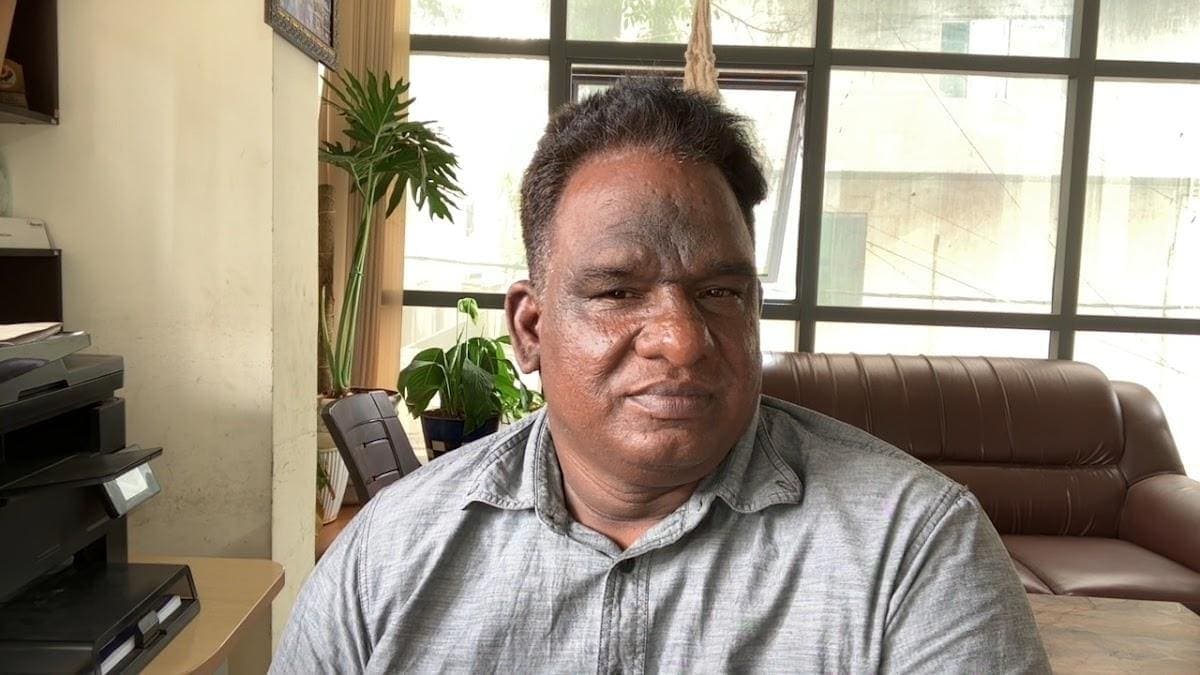 G Ramanathan seated in an office