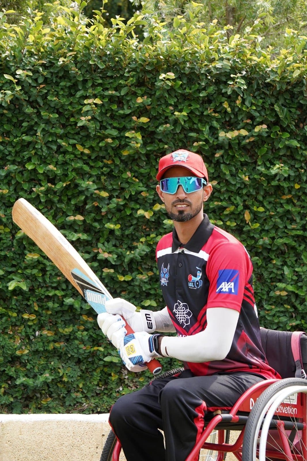Khaleel Ahmed holding a bat, ready to play