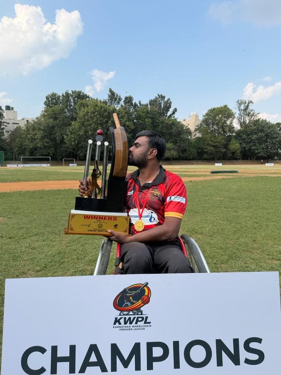 Sunil kissing the KWPL champions' trophy