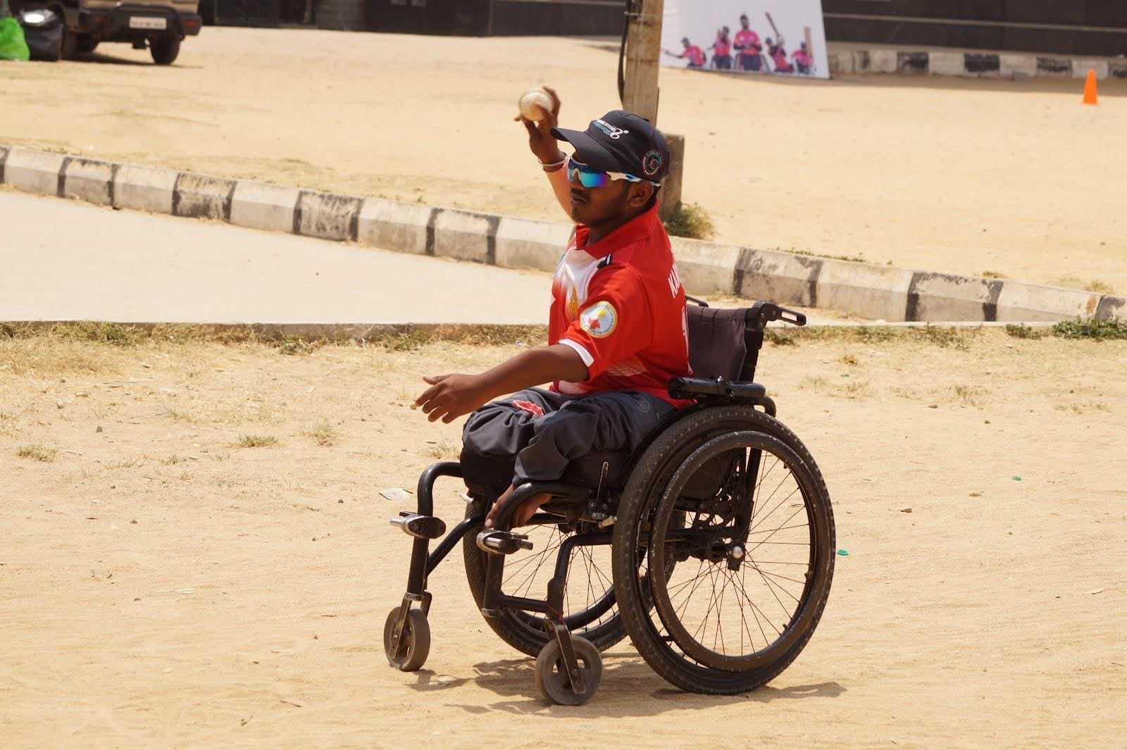 Huligesha in action on the field in a sports wheelchair