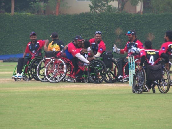 Bengaluru Eagles wheelchair cricket team celebrating together